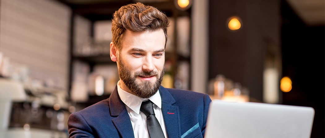 Businessman using tablet in living room